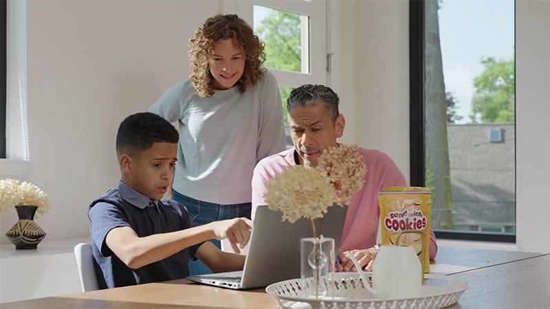 Three people sitting at table