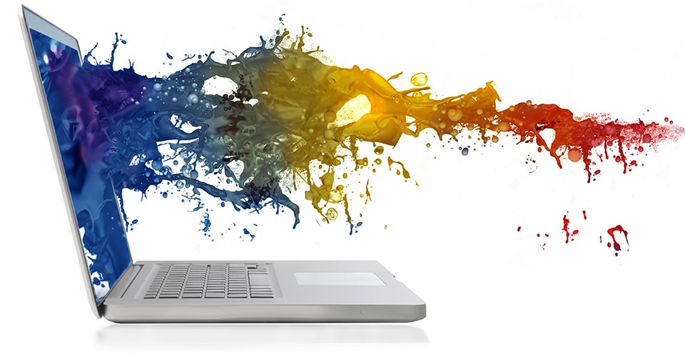 Laptop computer with colorful paint flowing out of the screen