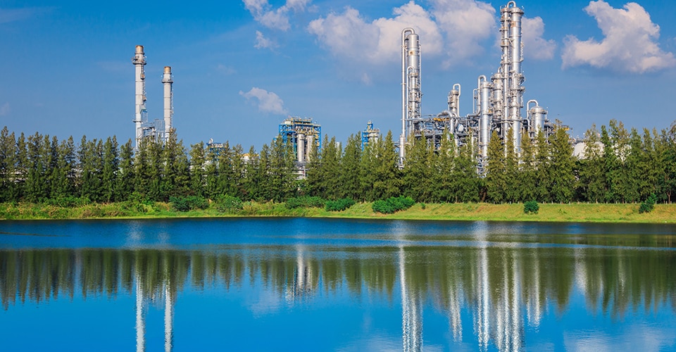 Dow plant in Thailand reflecting off lake