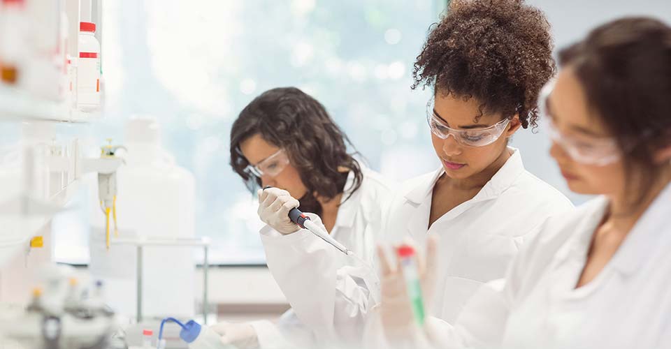 Female scientists perform tests in the lab