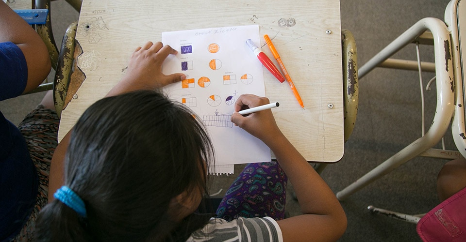 A student of Teach For All network partner Enseñá por Argentina practices math skills at a school in Buenos Aires, Argentina