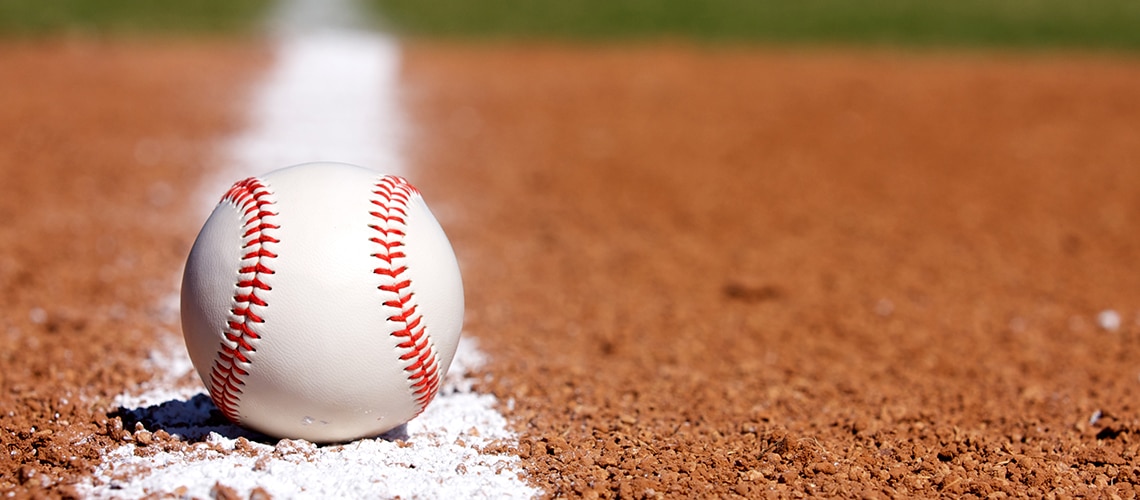 a baseball sitting on the foul line