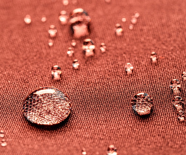 water droplets on red material