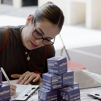 Dow volunteer completing paperwork to help an Eztli Project participant