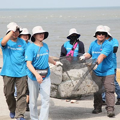 Volunteers participating in a beach clean up
