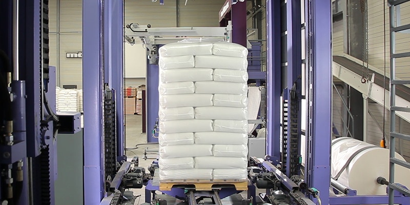 White sacks stacked on pallets
