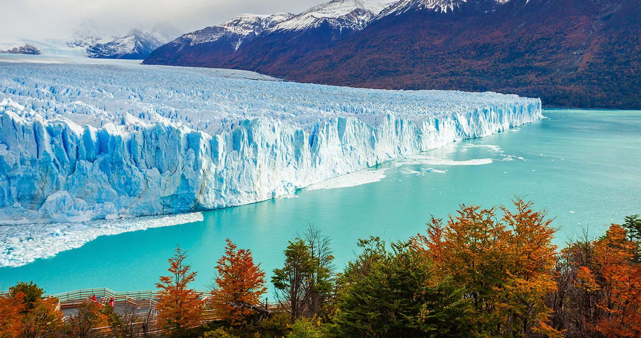 A glacier flows into the water