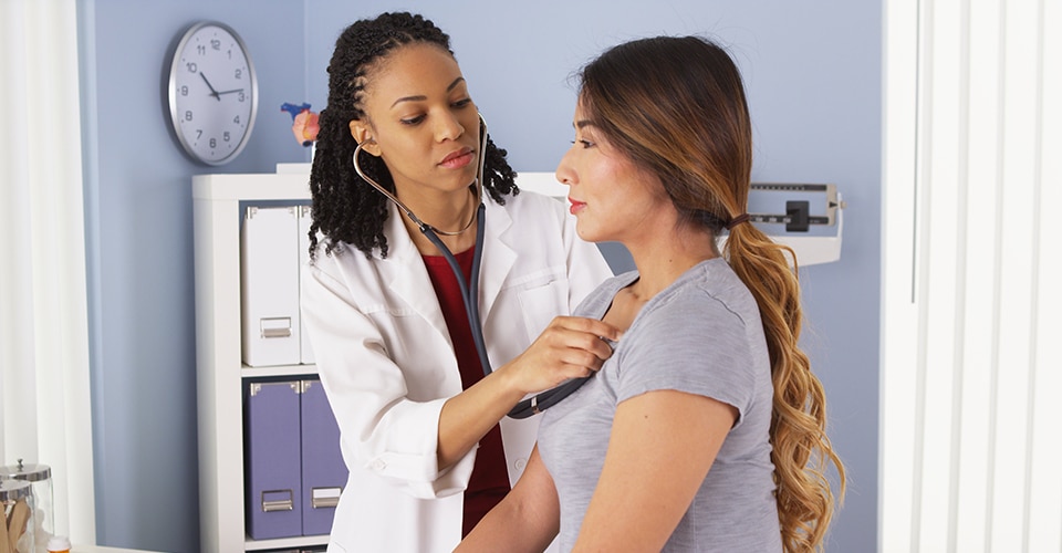 Doctor doing exam on patient