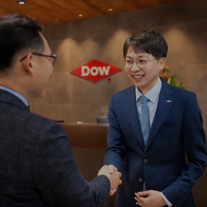 female Dow scientist works with lab equipment