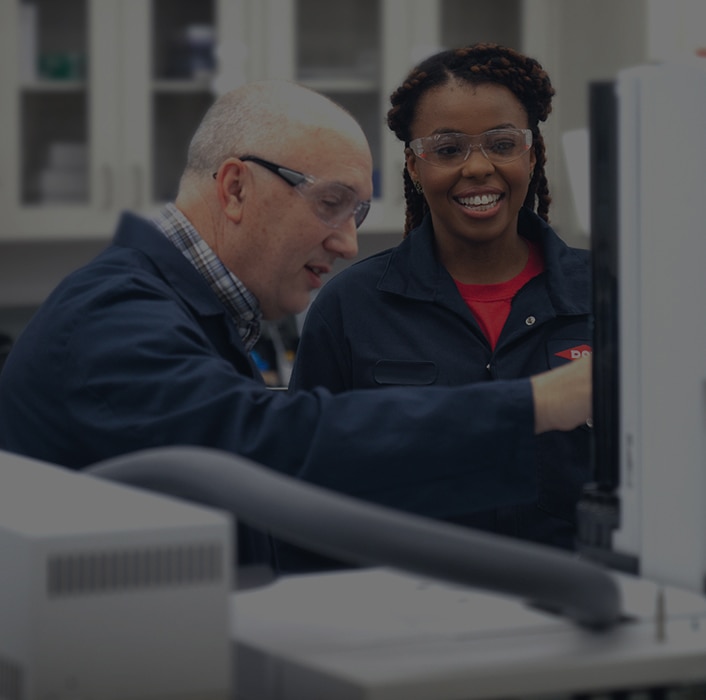 Two Dow colleagues work together in the lab