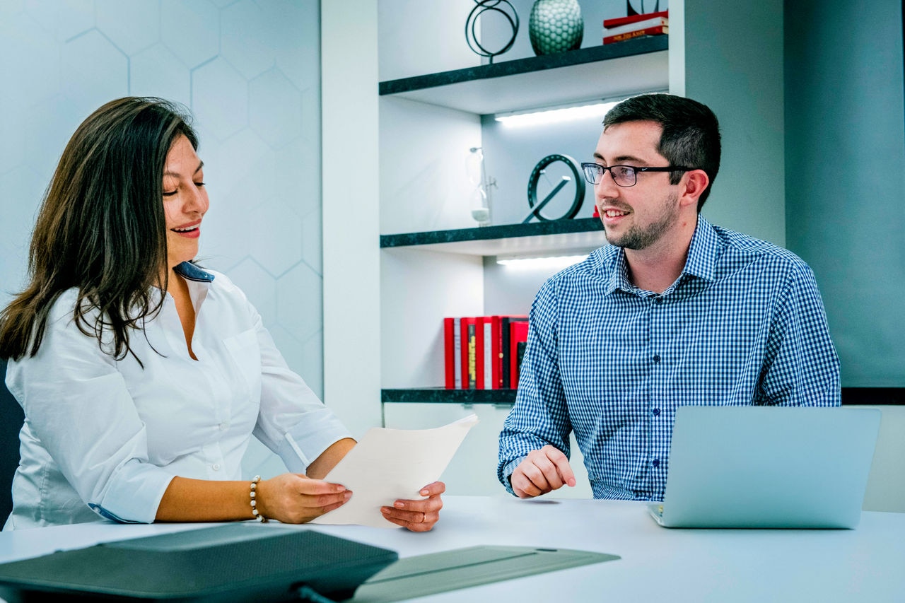 two colleagues looking at a tablet