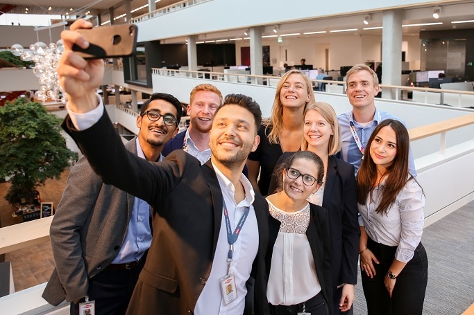 Colleagues pose for a selfie