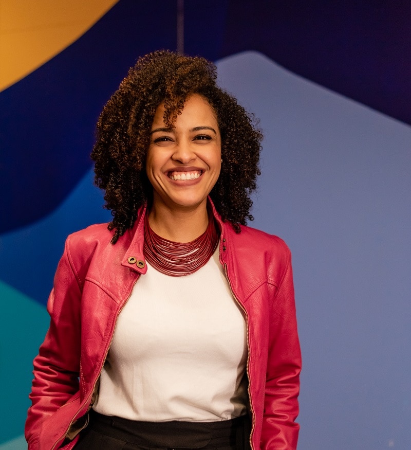 Smiling woman with a colorful background