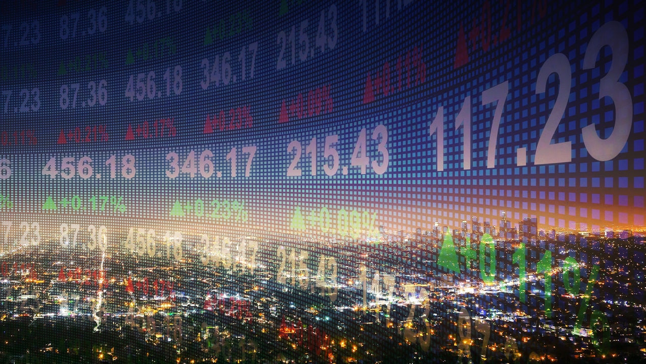 Finance ticker overlaid on city.