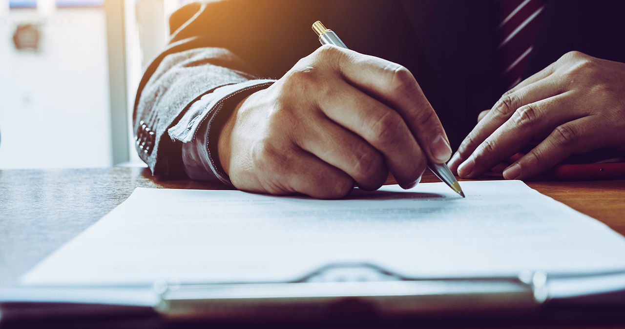 Business man sign a contract investment professional document agreement.
