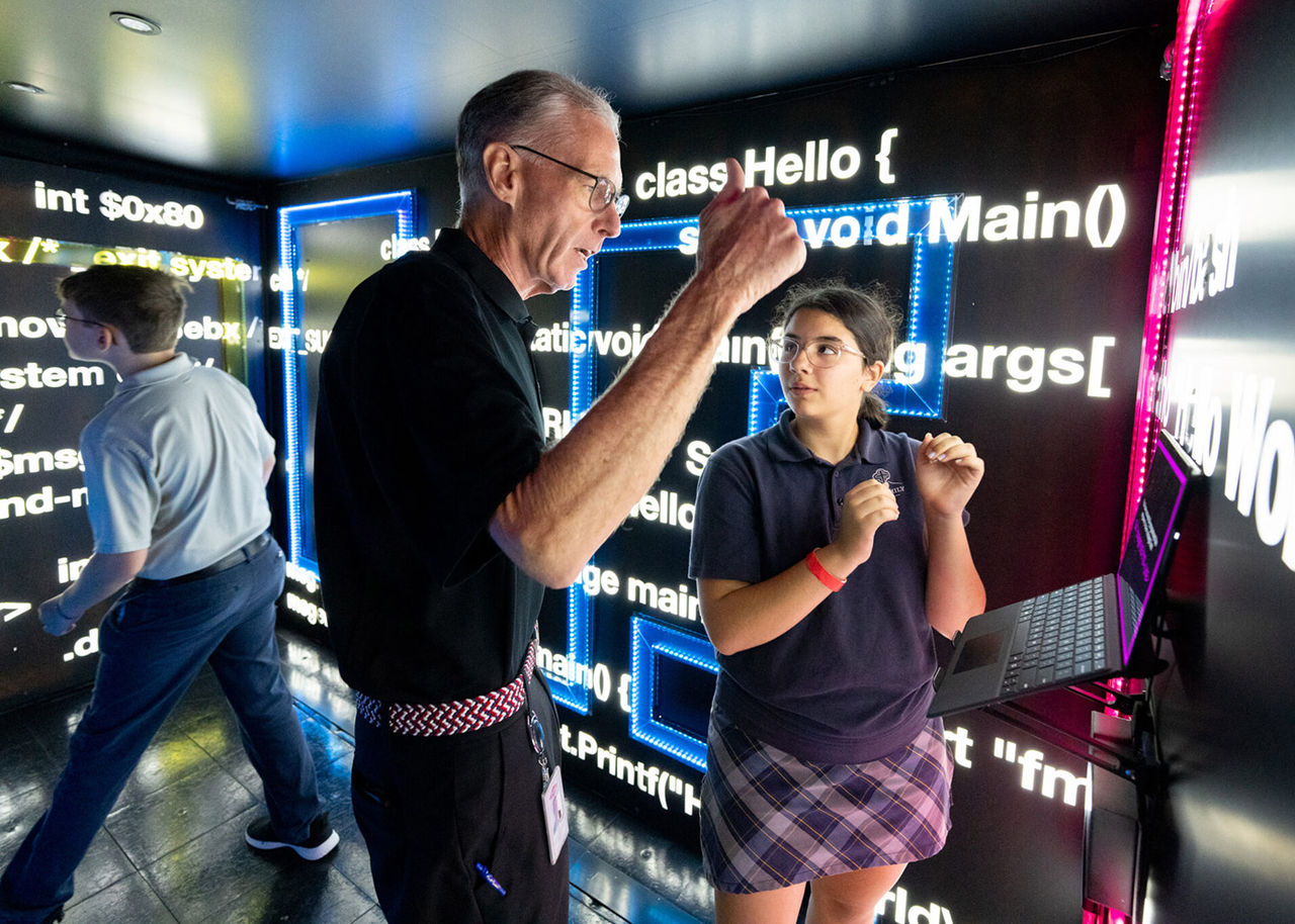 Jim Fitterling speaks with a student at Creators Wanted event in Louisiana