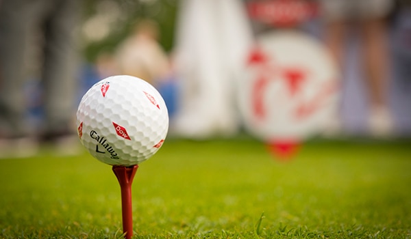 golf ball with Dow Diamond logo on a tee