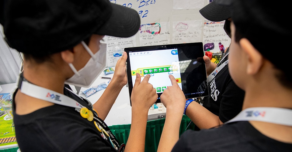 students working on an tablet