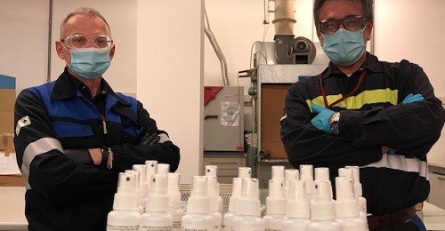 Workers prepare sanitizer for shipping