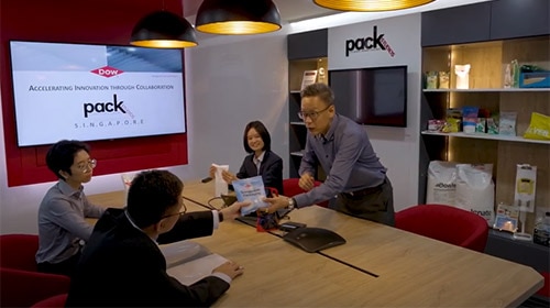 4 people meeting in PackStudios Singapore conference room