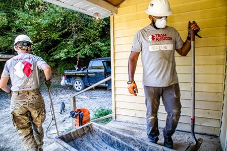 Team Rubicon Greyshirt volunteers muck out a home during the Kentucky Flooding Operations in September 2022.