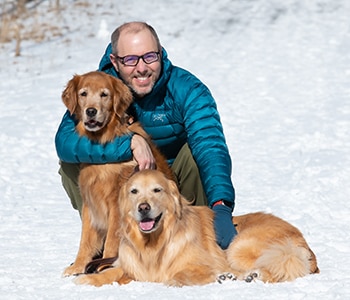 Andre Argenton with his dogs in the snow