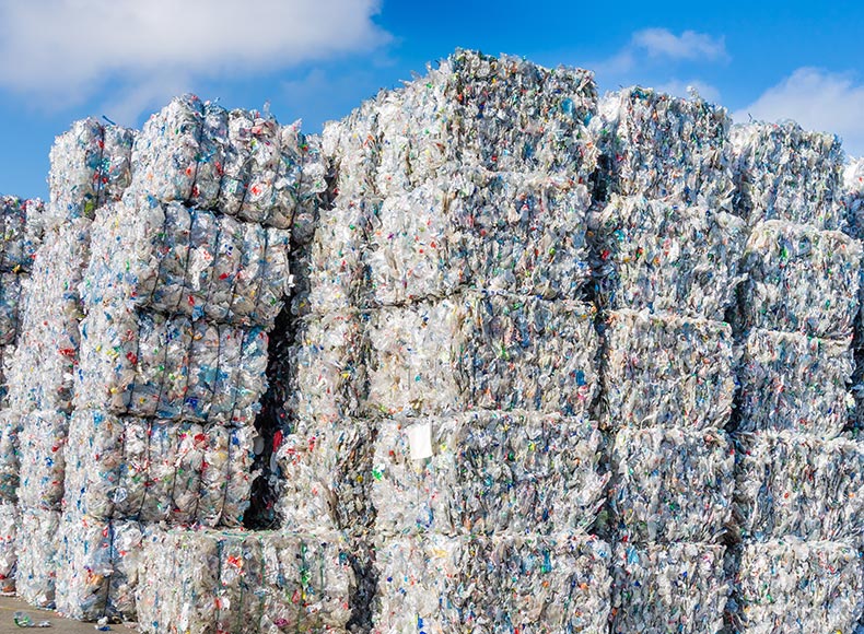 stacks of bundled plastics ready for recycling