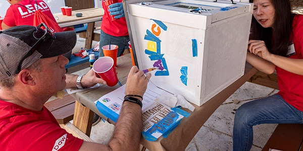 Dow volunteers painting