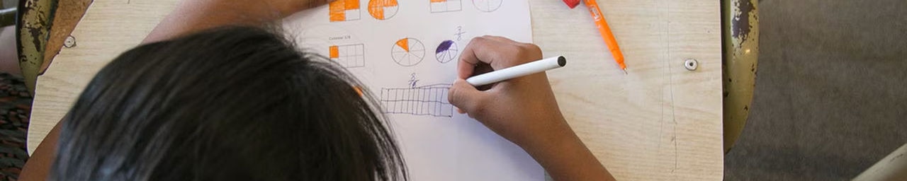 student working on school work at a desk