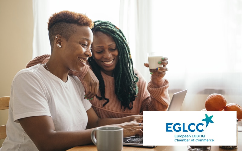 two women looking at a computer with the EGLCC logo