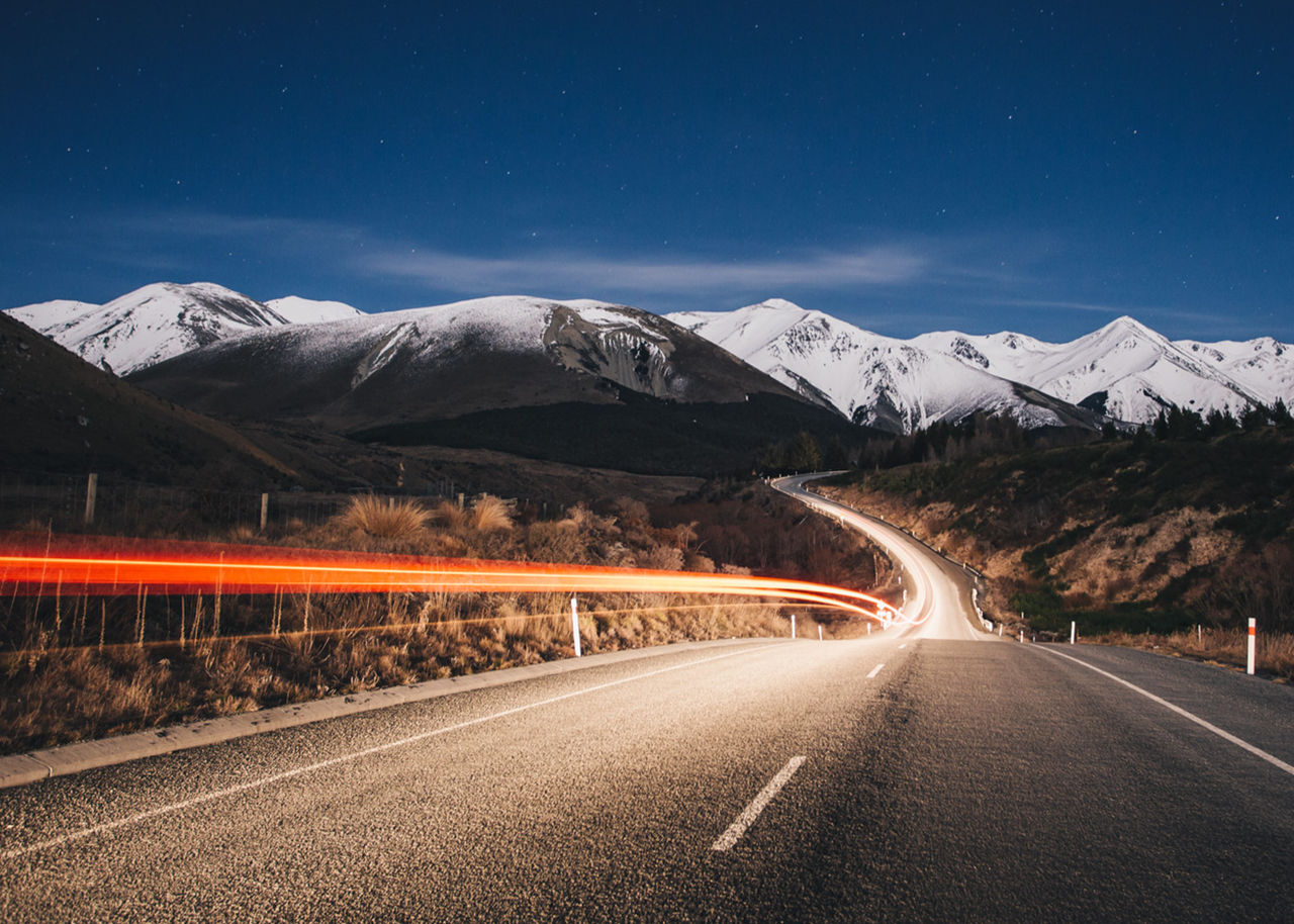 road with mountains in background
