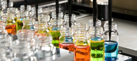 Vials being filled with different colored fluids