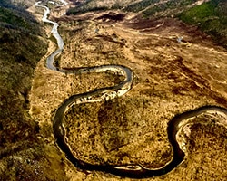 Aerial view of a river winding through a valley