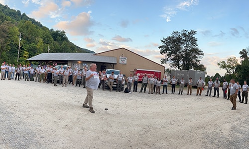 Team Rubicon Greyshirt volunteers during a morning brief at the Kentucky Flooding Operations in September 2022.