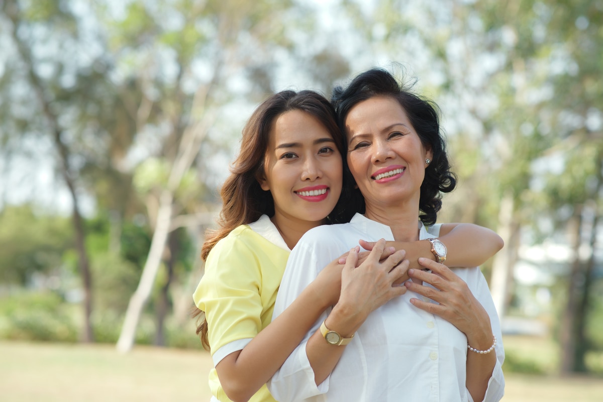 Portrait of beautiful Vietnamese lady hugging her mother from behind; Shutterstock ID 264134003; ; Client/Contact: Dow;